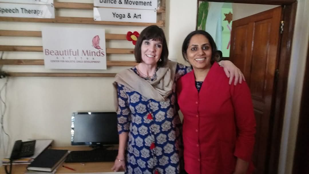 Team members at the Astitva centre, with therapy signage in the background