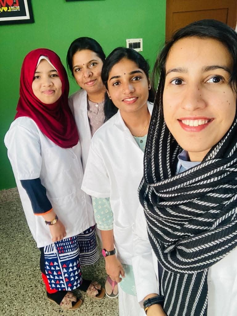 Team members smiling together at the centre