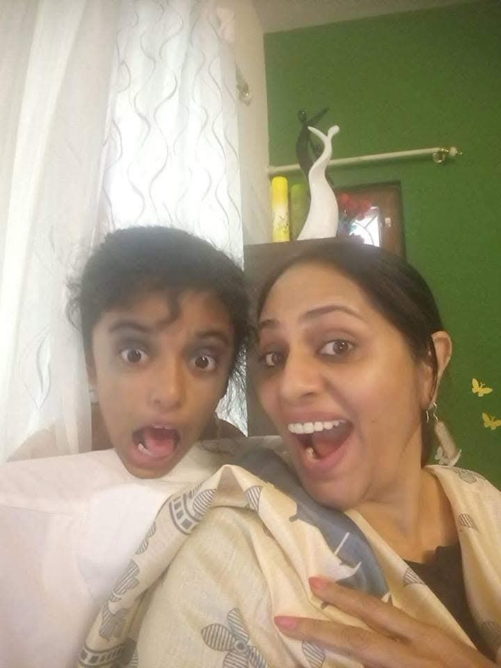 A joyful candid moment between a parent and child